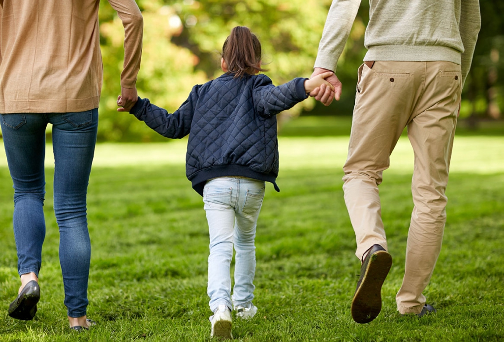 happy-family-walking-in-summer-park family foster adopt options social services