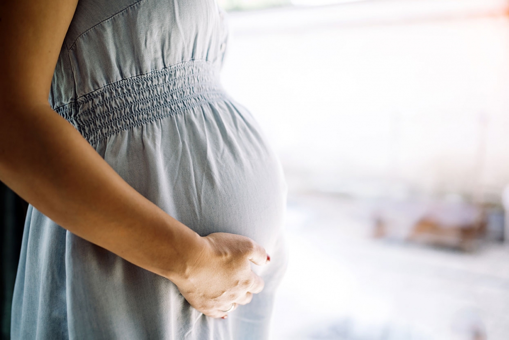 pregnant-woman-holding-belly family infant adoption options social services pregnant baby mother